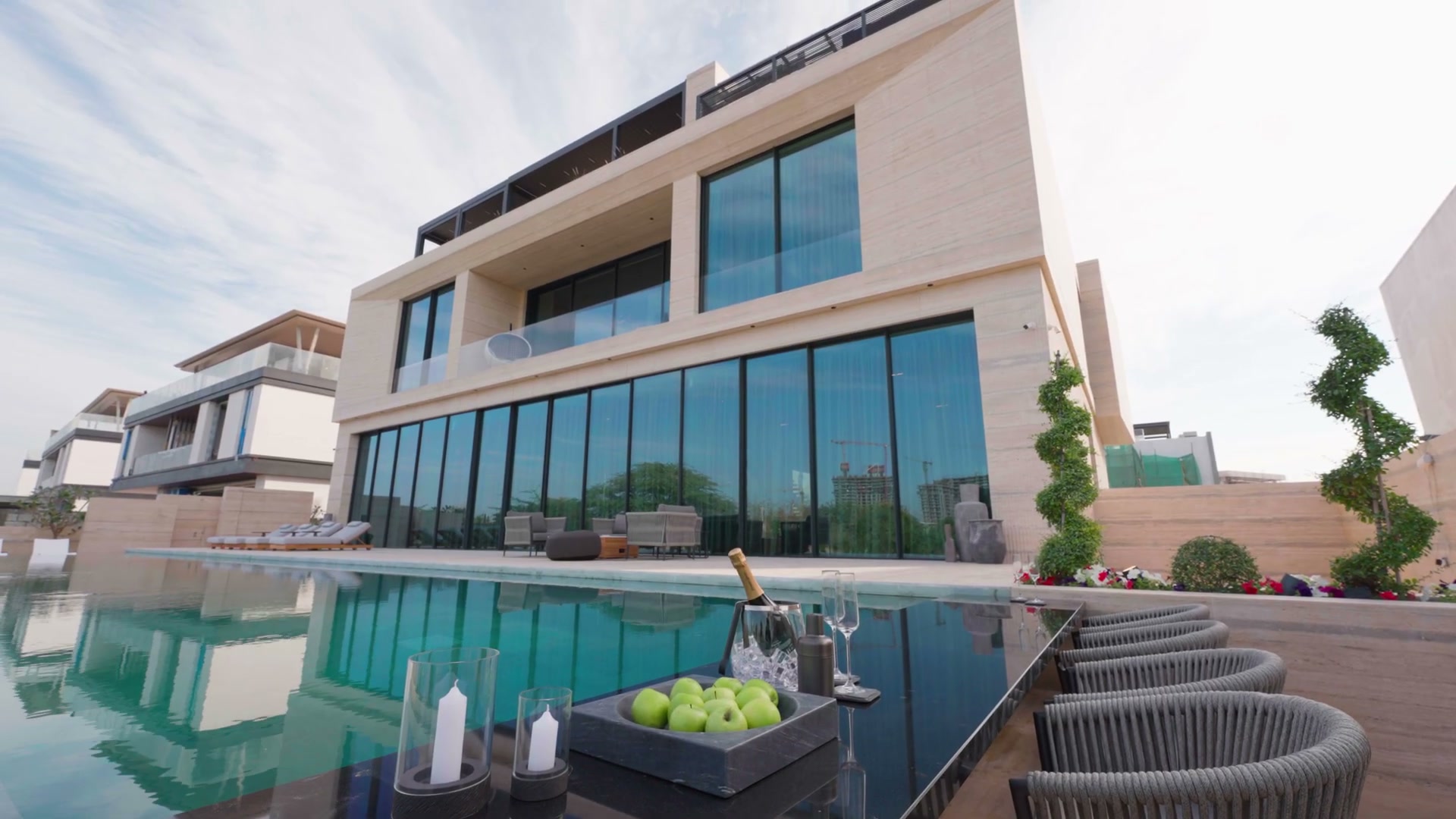 A villa and pool arranged for a considered presentation