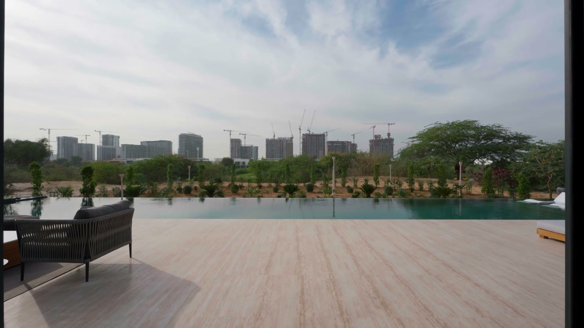 A restrained contemporary terrace with a broad Dubai residential outlook